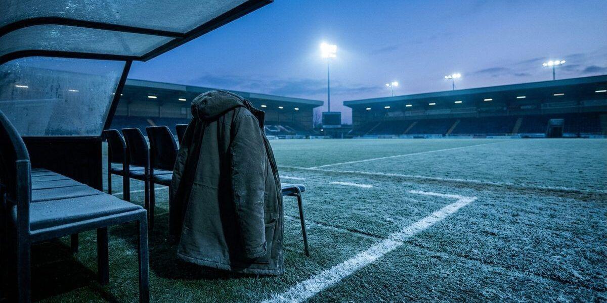 Arsene Wenger on the touchline in his coat, 2016
