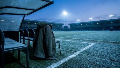Arsene Wenger on the touchline in his coat, 2016